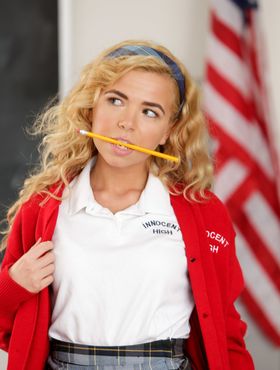 Adorable schoolgirl Alina West spreads shaved teen pussy in classroom strip