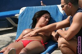 Black haired bathing beauty Giselle Vega gets big tits & ass massaged poolside