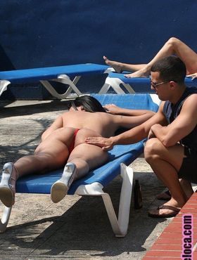 Black haired bathing beauty Giselle Vega gets big tits & ass massaged poolside