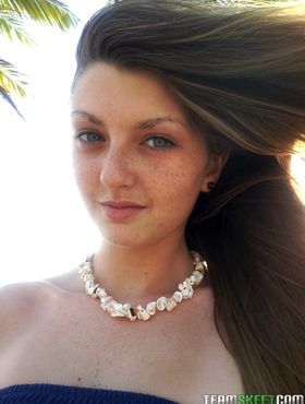 Elegant blue eyed teen Staci Silverstone flashes shaved pussy upskirt on beach