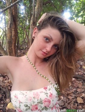 Big eyed beauty Staci Silverstone disrobes in the woods to vaunt natural tits