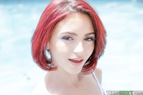 Petite redhead Lola Fae tasing by the pool in her sexy red swimming suit