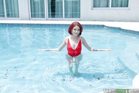 Petite redhead Lola Fae tasing by the pool in her sexy red swimming suit
