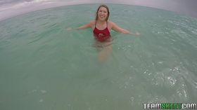 Teen babe Kimber Lee flashing large natural tits in the ocean