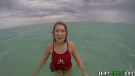 Teen babe Kimber Lee flashing large natural tits in the ocean