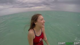 Teen babe Kimber Lee flashing large natural tits in the ocean