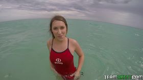 Teen babe Kimber Lee flashing large natural tits in the ocean