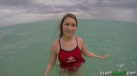 Teen babe Kimber Lee flashing large natural tits in the ocean