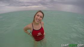 Teen babe Kimber Lee flashing large natural tits in the ocean