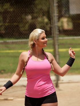 Pigtailed ball player Phoenix Marie exposes round big tits on the diamond