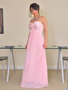 Classy MILF shows off her pink pussy after removing her evening gown