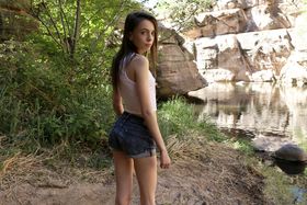 Skinny teen Aria Haze shows off her thin body masturbating naked in the woods