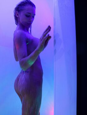 Busty Alix taking a hot shower