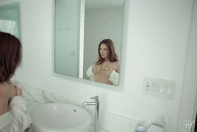 Phenomenal redhead Cassie Laine relaxing naked in the bathroom