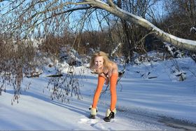 Cold winter day isn't a problem for skinny babe in orange stockings Angelika D