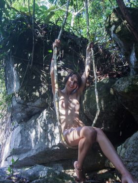 Thin teen Alisa M goes barefoot while posing totally naked in the forest