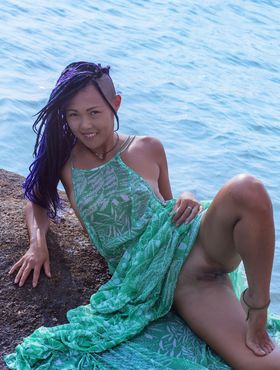 Hot Asian teen Sweet Julie removes wet dress for nude poses in water