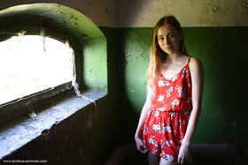 Tall teen Marika B strikes great nude poses in front of seaside window