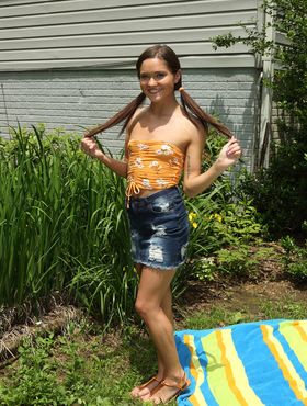 Horny teen Zoe Bloom insets vegetable in asshole and pussy on backyard blanket