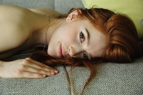 Young redhead Jia Lissa proudly displays her freshly trimmed bush