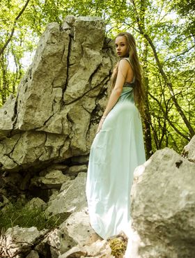 Teen princess in long dress Milena D teases with her hairy pussy in the woods