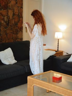 Natural redhead Adel C fingers her pink pussy in white robe