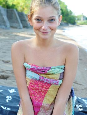 Cutie with blue eyes and innocent smile Indi shows teen body off on the beach
