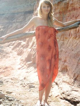 Slim teen Eriska A exposes her tan lined body while wandering a canyon