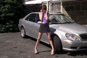 Slim teen Angelina masturbates with a dildo on car mat in driveway
