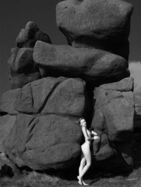 Gorgeous teen model Sophia S poses for B&W shoot amid weathered rocks