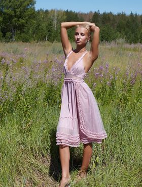 Sunny weather motivates skinny blonde Afina to relax naked in middle of field