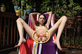 Skinny teen girl Aria Haze takes off her bikini and pegs her twat on patio