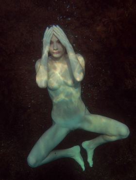 White teen Frida C frees her nice tits as she removes bikini for a nude swim