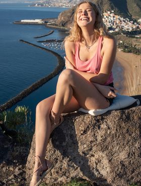 Fit teen Casey rides a stationary bike before posing naked at a lookout spot
