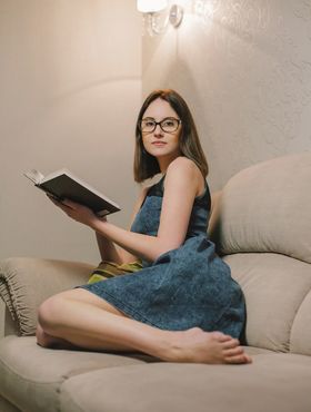 Teen nerdy girl Sade Mare plays with her small pussy after reading a book