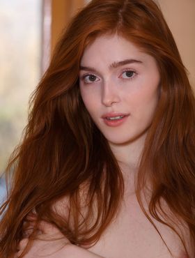 Redhead teen Jia Lissa shows her landing strip pussy in fetish clothing