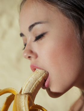 Sensation big tit teen Li Moon shows her sexy body as she eats banana