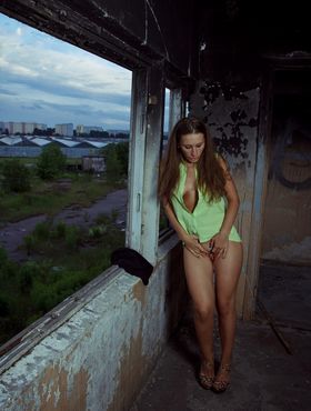 Horny white chick heads into abandoned building to masturbate by herself