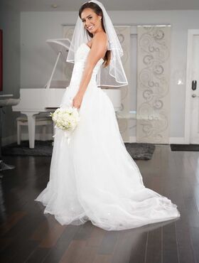 Beautiful bride Kelsi Monroe doffs her wedding dress to show her slender body