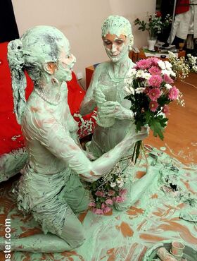 Euro chick Virus Vellons and gf cover each other in St Paddy's day cake batter