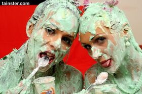 Euro chick Virus Vellons and gf cover each other in St Paddy's day cake batter