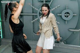 Clothed party girls dance away while ship's shower rains down on them