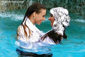Nikky Thorne has some wet fully clothed pool fun with herfriend