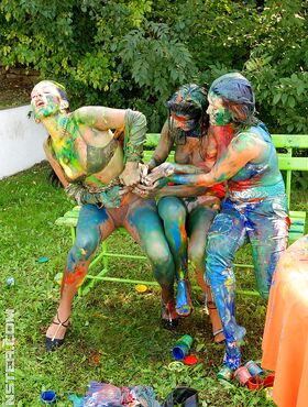 Playful european fetish ladies have some messy body art fun at the poolside