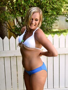 30 plus blonde Tucker Stevens sheds her bra and panties to pose nude in yard