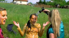 Naughty european fetish gals have some wet fully clothed fun outdoor