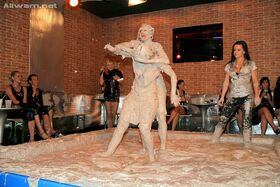 Kinky fetish ladies make some fully clothed mud wrestling action