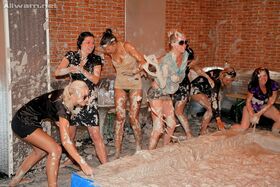 Stunning fetish ladies have some fully clothed mud wrestling fun