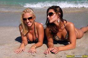 Busty blonde Gracie has hot dildo beach fun with her busty brunette friend