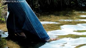 Fully clothed fetish babe in jeans Gina Killmer getting wet outdoor